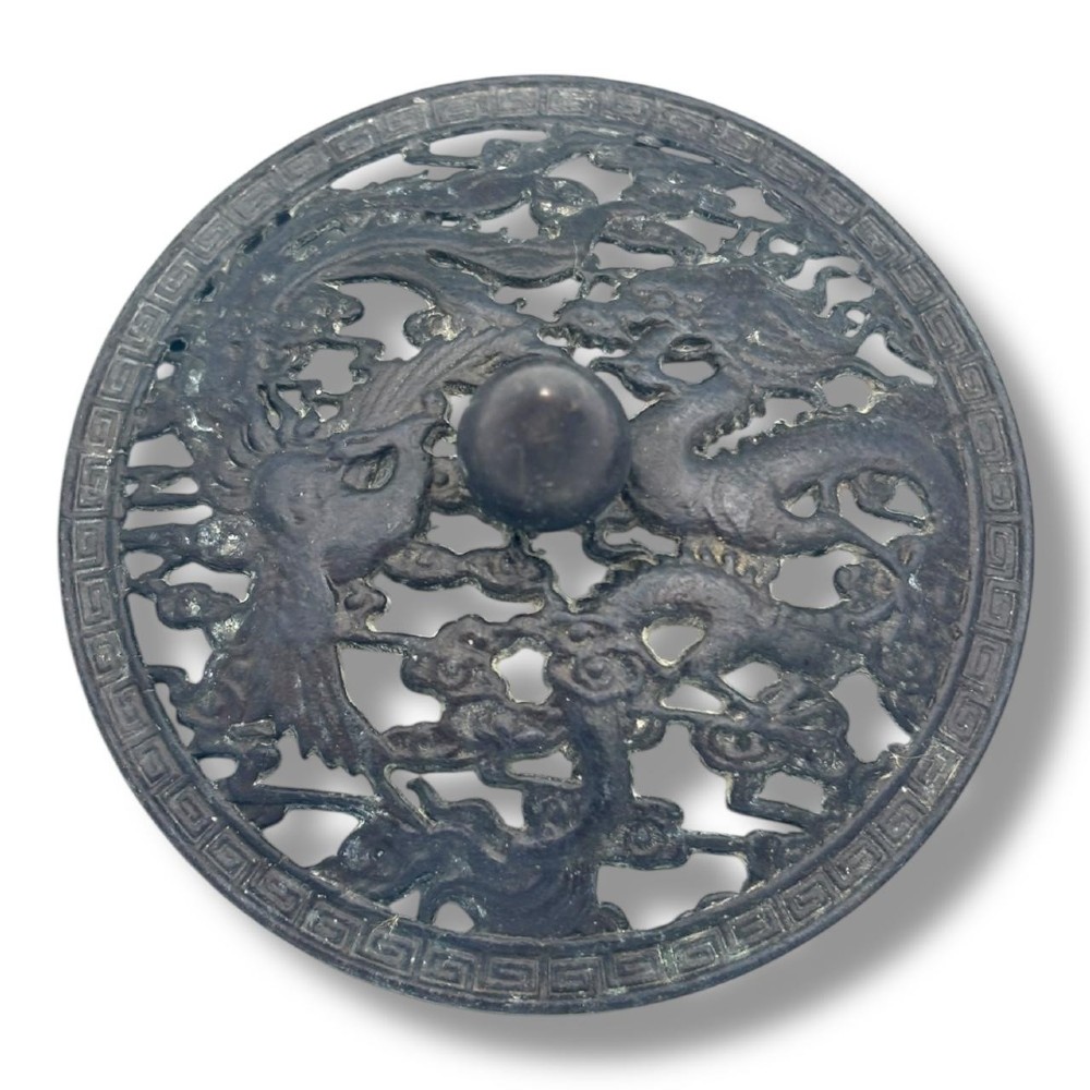 A dark patinated bronze tripod censer featuring a rounded body, three short tapered feet, and a pierced openwork lid topped with a bud finial. View VII
