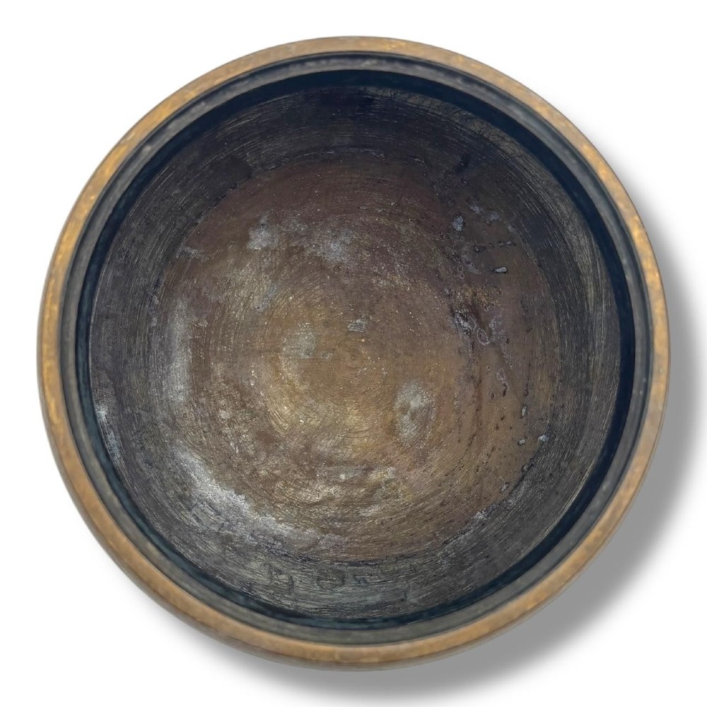 A Chinese bronze tripod censer featuring a compressed circular body, three tapered feet, and a reticulated lotus lid topped with a pointed finial. View V