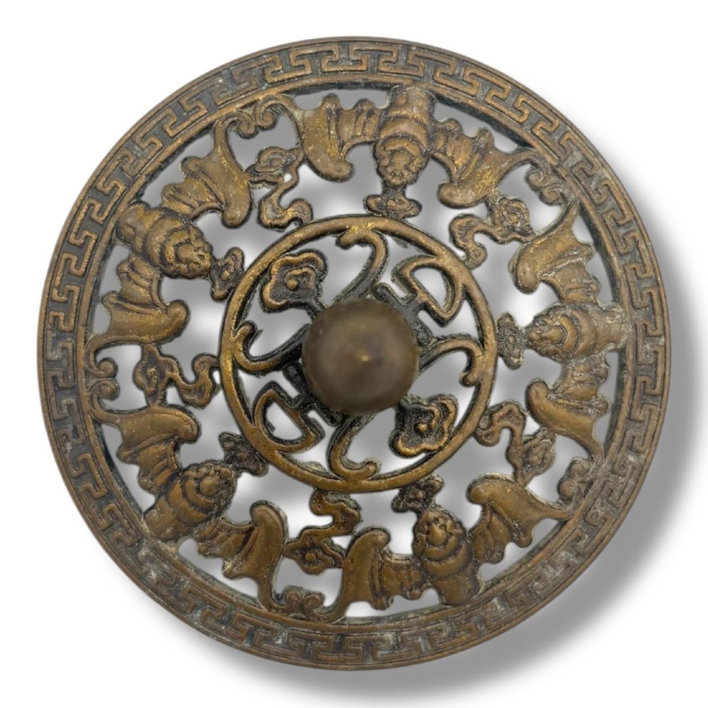 A Chinese bronze tripod censer featuring a compressed circular body, three tapered feet, and a reticulated lotus lid topped with a pointed finial. View VI