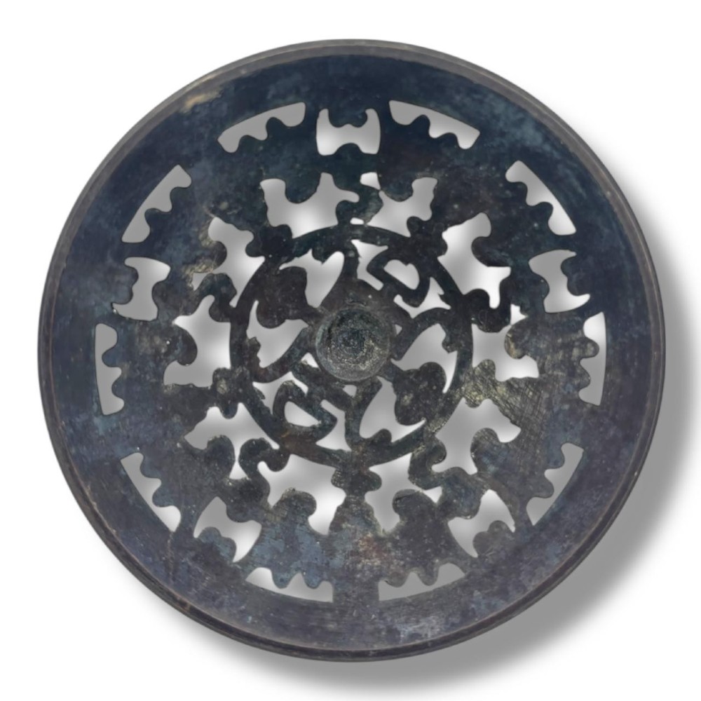 A Chinese bronze tripod censer featuring a compressed circular body, three tapered feet, and a reticulated lotus lid topped with a pointed finial. View VII