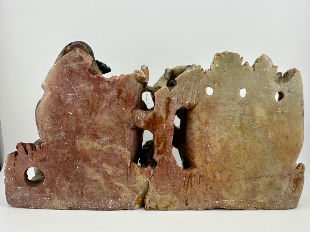 An antique Chinese carved soapstone double brush washer featuring two vessel shapes supported by carved animals and pierced rockwork in shades of mottled green, cream, and dark grey. View VII