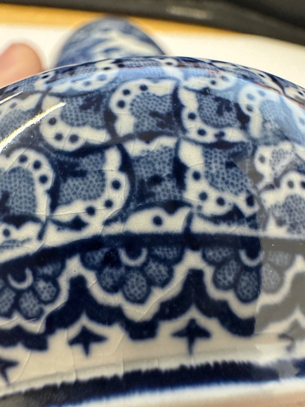 A pair of antique blue and white ceramic vases featuring central pastoral vignettes framed by elaborate scrollwork patterns. View IV