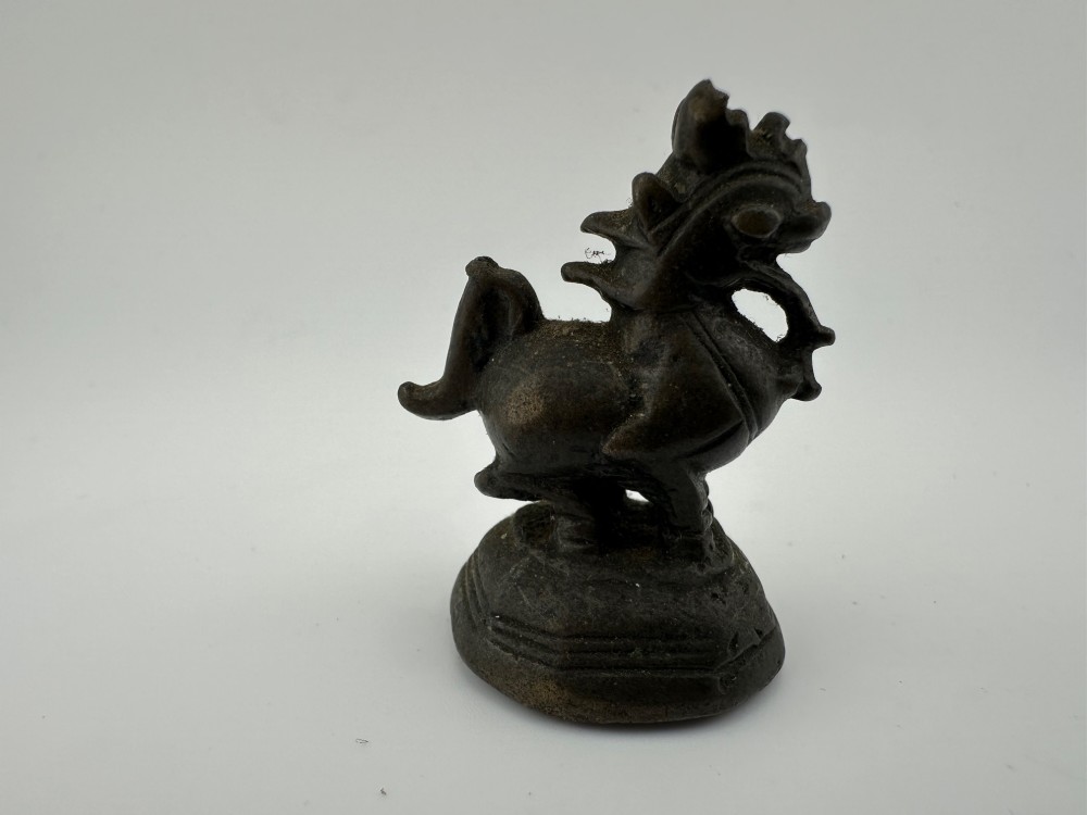 A set of six dark bronze zoomorphic trade weights depicting various animals mounted on octagonal and circular pedestals. View IV