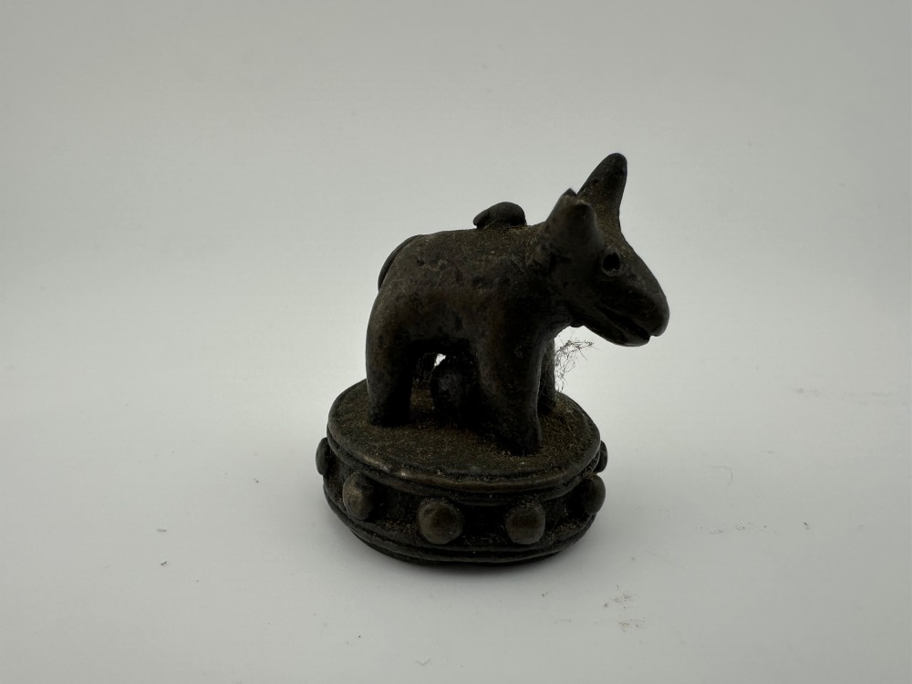 A set of six dark bronze zoomorphic trade weights depicting various animals mounted on octagonal and circular pedestals. View V