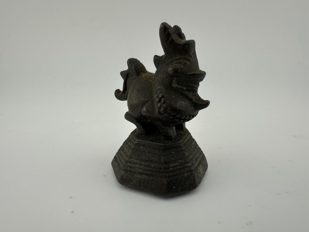 A set of six dark bronze zoomorphic trade weights depicting various animals mounted on octagonal and circular pedestals. View VI