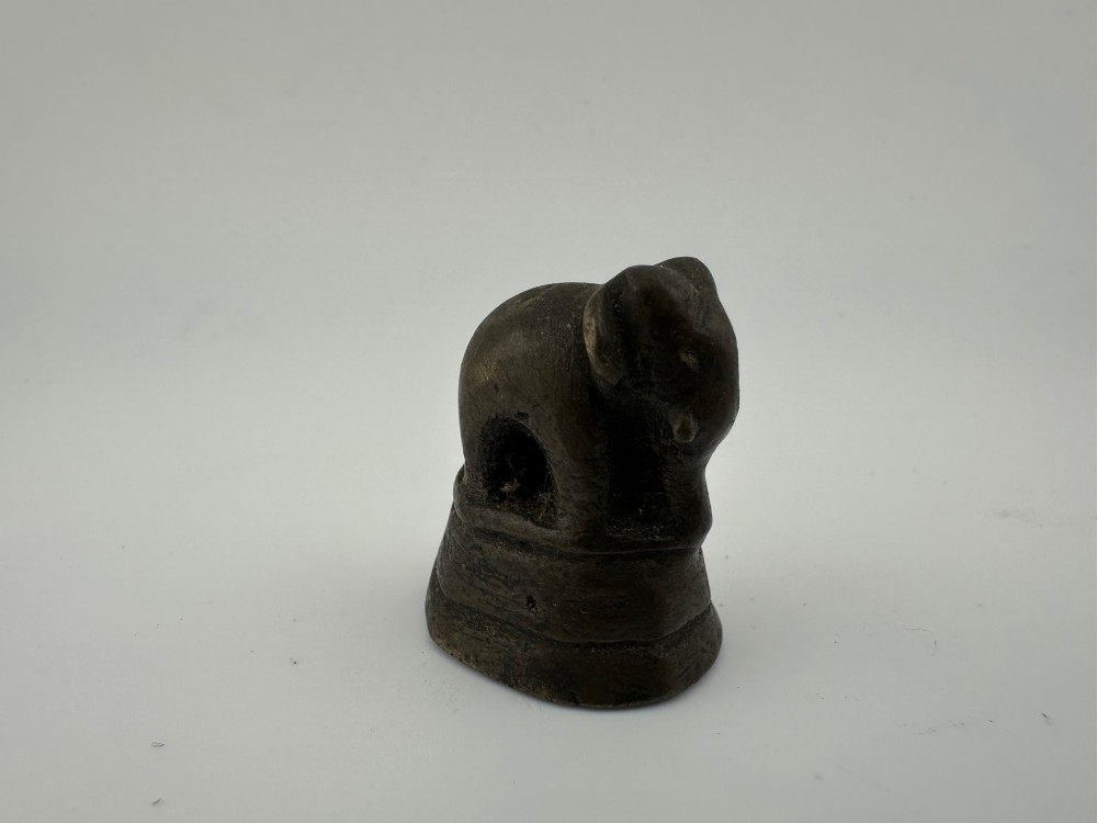 A set of six dark bronze zoomorphic trade weights depicting various animals mounted on octagonal and circular pedestals. View VII
