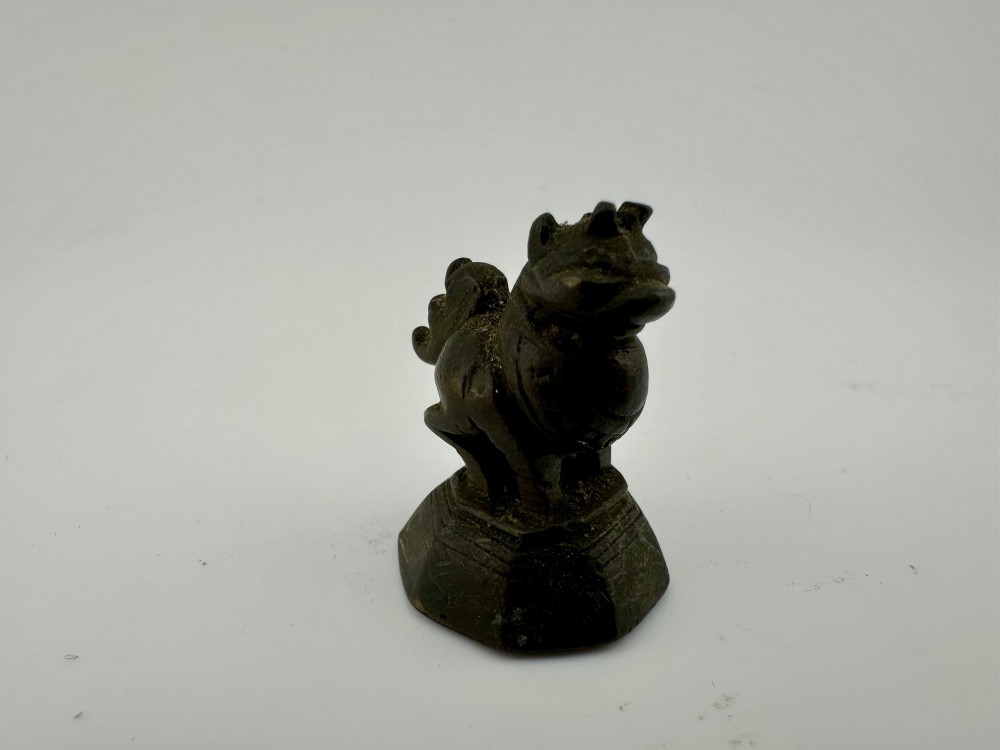 A set of six dark bronze zoomorphic trade weights depicting various animals mounted on octagonal and circular pedestals. View VIII