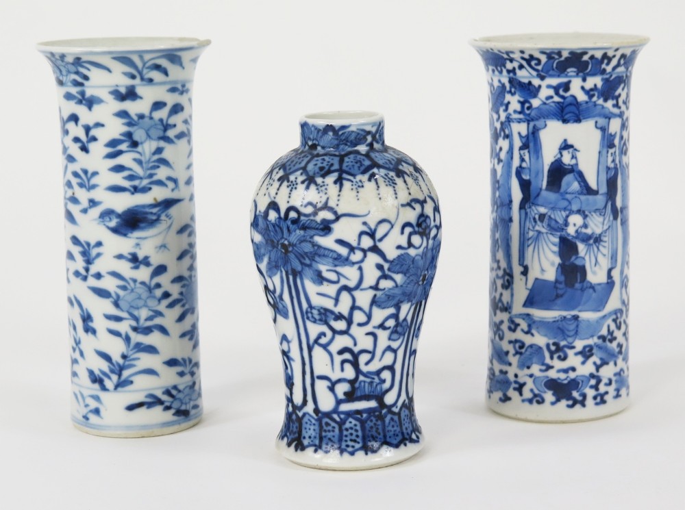 A set of three 19th-century Chinese blue and white porcelain vases featuring hand-painted floral motifs and figurative scenes.