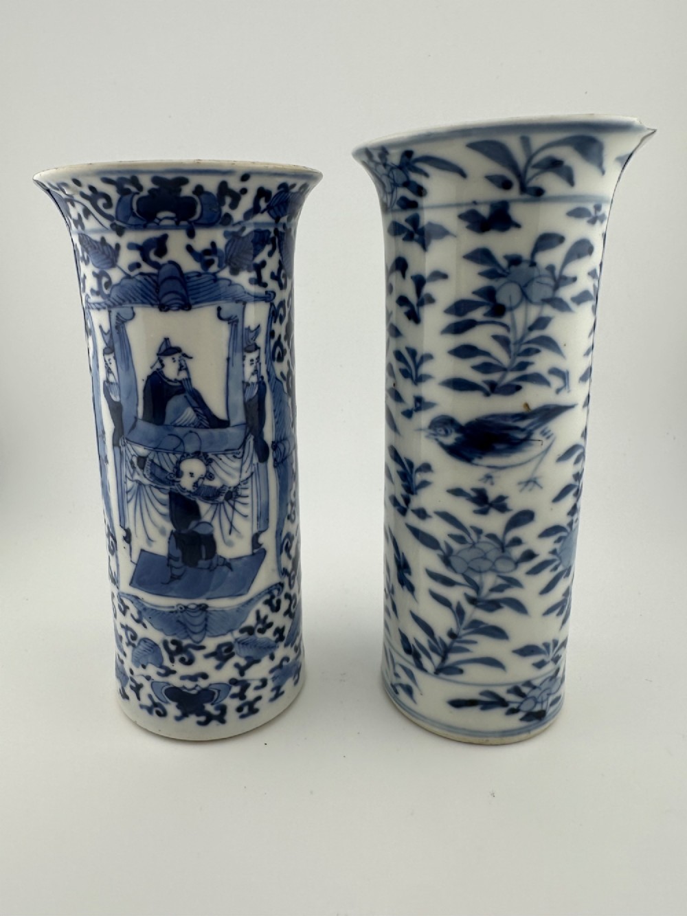 A set of three 19th-century Chinese blue and white porcelain vases featuring hand-painted floral motifs and figurative scenes. View VIII