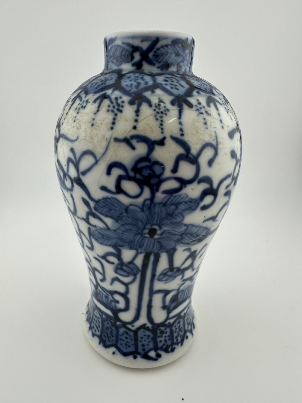 A set of three 19th-century Chinese blue and white porcelain vases featuring hand-painted floral motifs and figurative scenes. View XI