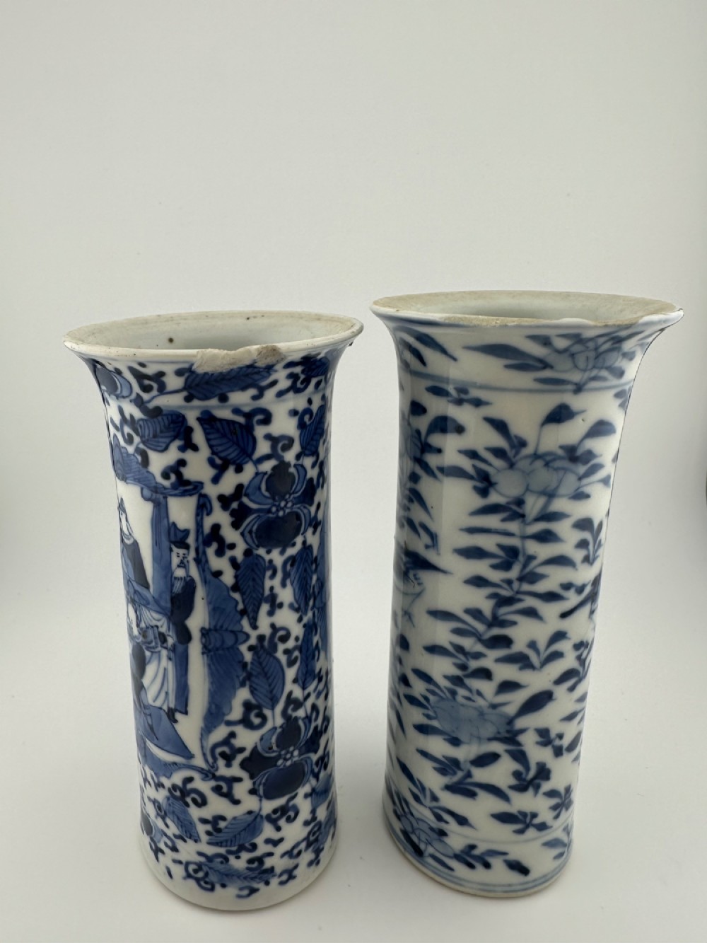 A set of three 19th-century Chinese blue and white porcelain vases featuring hand-painted floral motifs and figurative scenes. View XII