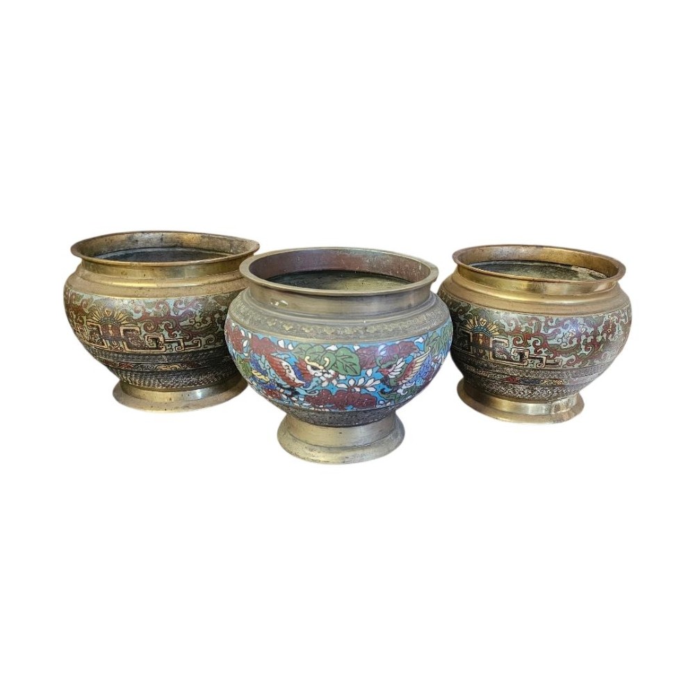 A set of three bulbous antique Chinese bronze jardinieres featuring colourful champleve enamel floral decoration around their midsections.