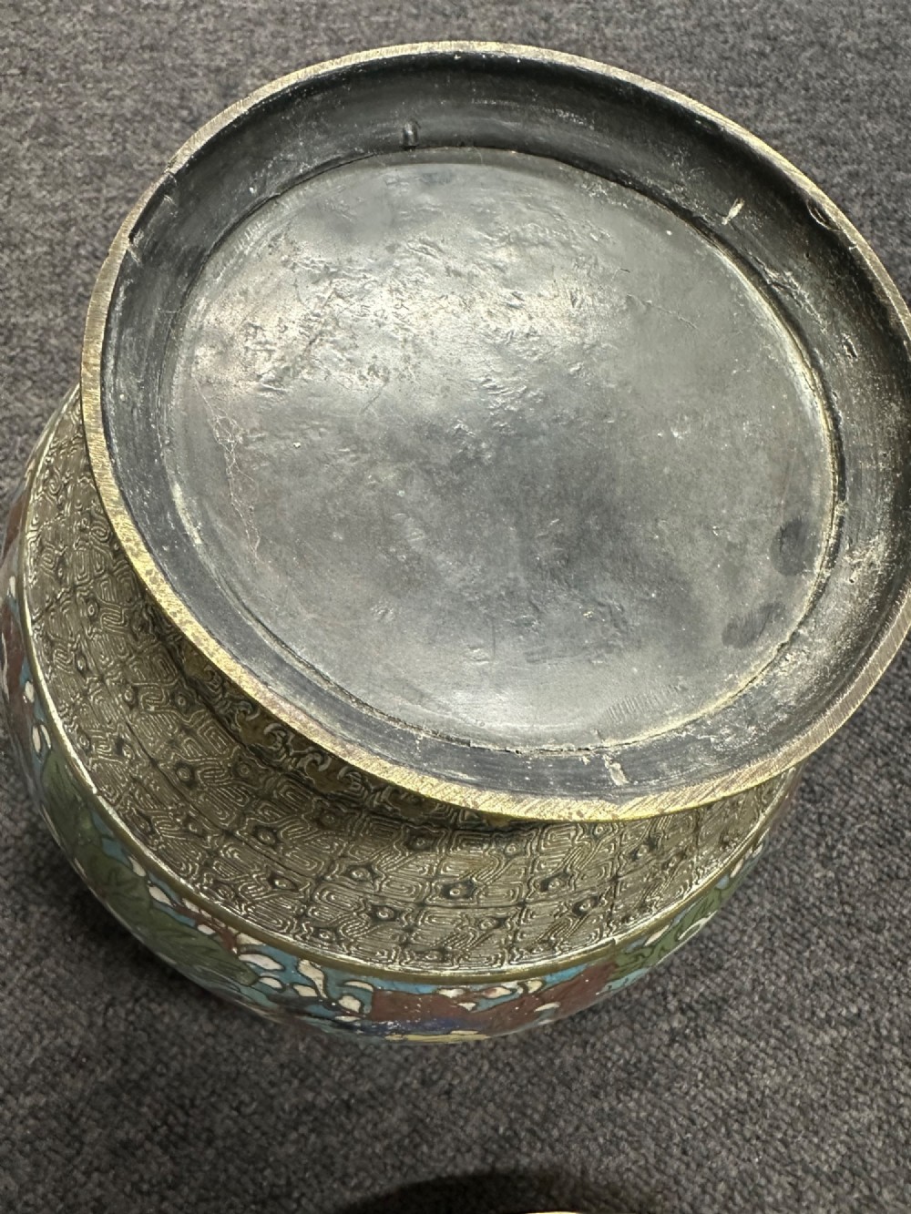 A set of three bulbous antique Chinese bronze jardinieres featuring colourful champleve enamel floral decoration around their midsections. View IX