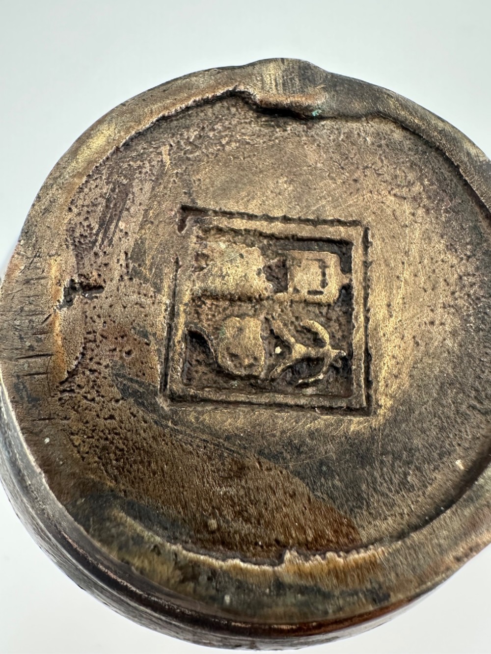 A dark cast bronze Chinese teapot featuring a sculpted dragon handle, a dragon-head spout, and raised Chinese character carvings on the main body. View VIII