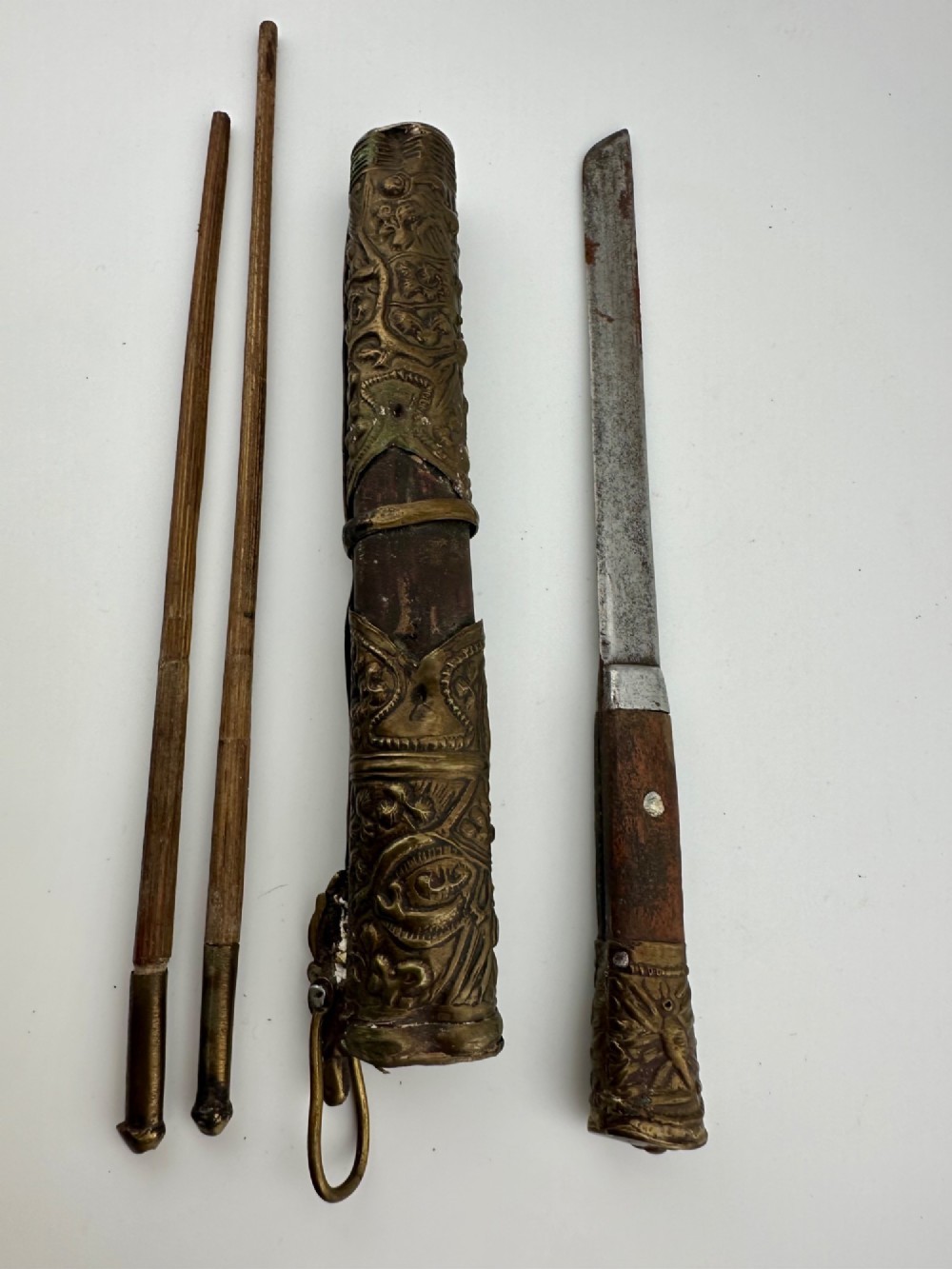 A 19th-century Chinese Qing Dynasty travelling eating set with chopsticks and knife stored inside an embossed brass-mounted sheath. View II
