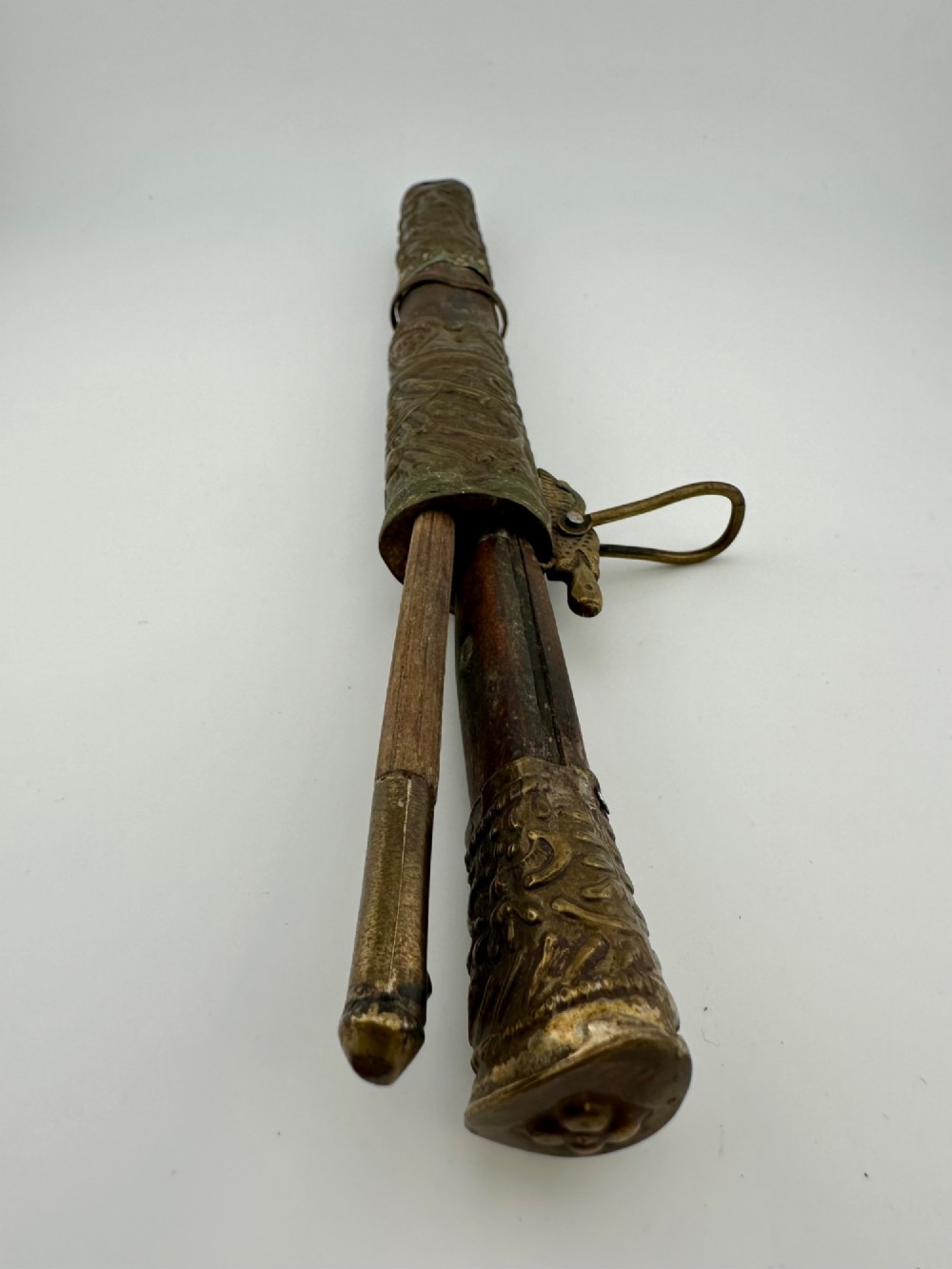 A 19th-century Chinese Qing Dynasty travelling eating set with chopsticks and knife stored inside an embossed brass-mounted sheath. View VII