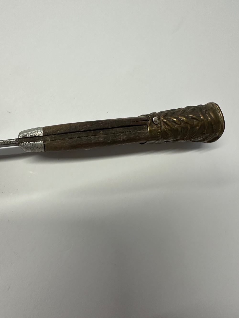 A 19th-century Chinese Qing Dynasty travelling eating set with chopsticks and knife stored inside an embossed brass-mounted sheath. View X