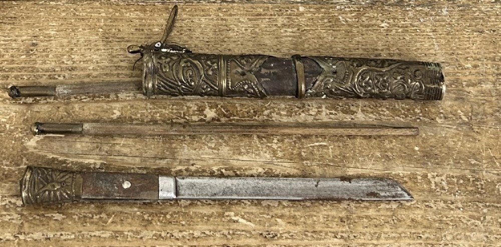 A 19th-century Chinese Qing Dynasty travelling eating set with chopsticks and knife stored inside an embossed brass-mounted sheath. View XI
