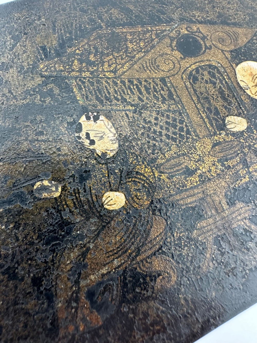 An early 19th-century rectangular black lacquer box with gilded painted Chinese figural scenes on the lid. View XIII