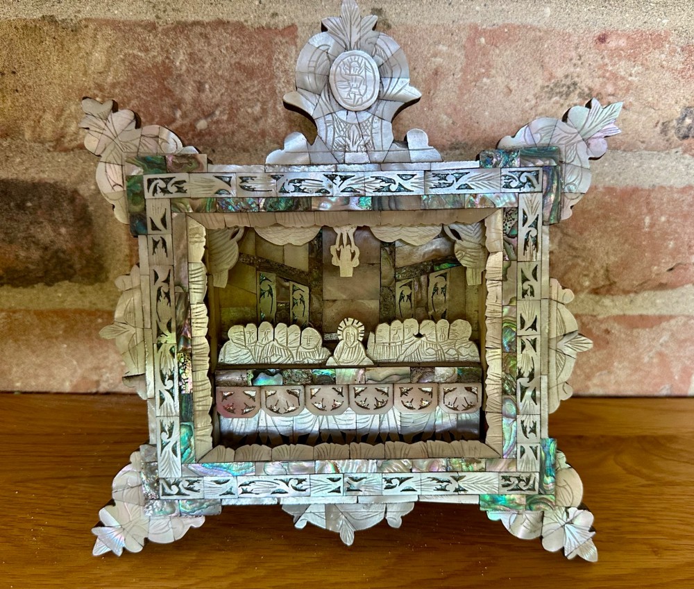 An antique hand-carved mother of pearl and abalone shell diorama frame depicting the Last Supper with elaborate cresting. View X