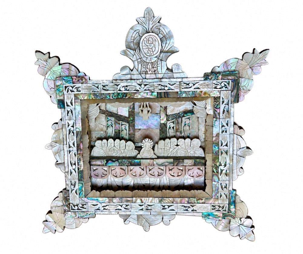 An antique hand-carved mother of pearl and abalone shell diorama frame depicting the Last Supper with elaborate cresting.