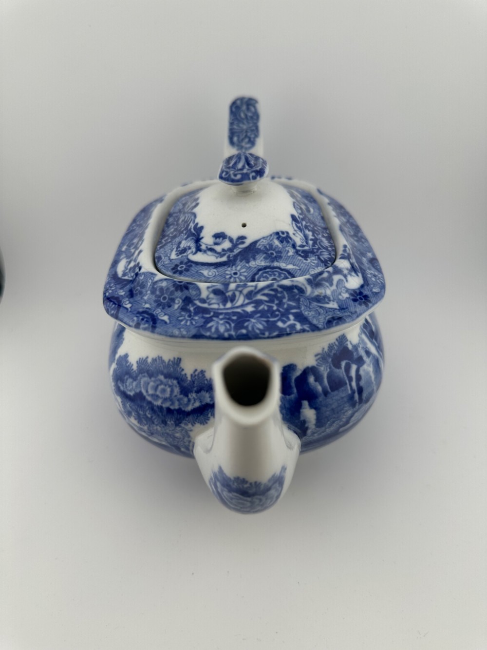 An antique blue and white transferware ceramic teapot in the Copeland Spode Blue Italian pattern featuring an Egyptian shape profile. View IV
