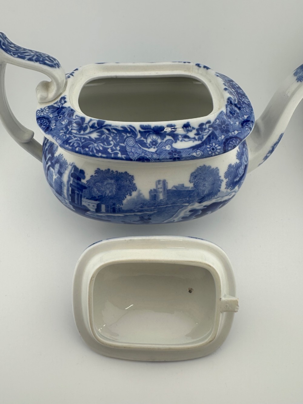 An antique blue and white transferware ceramic teapot in the Copeland Spode Blue Italian pattern featuring an Egyptian shape profile. View VII