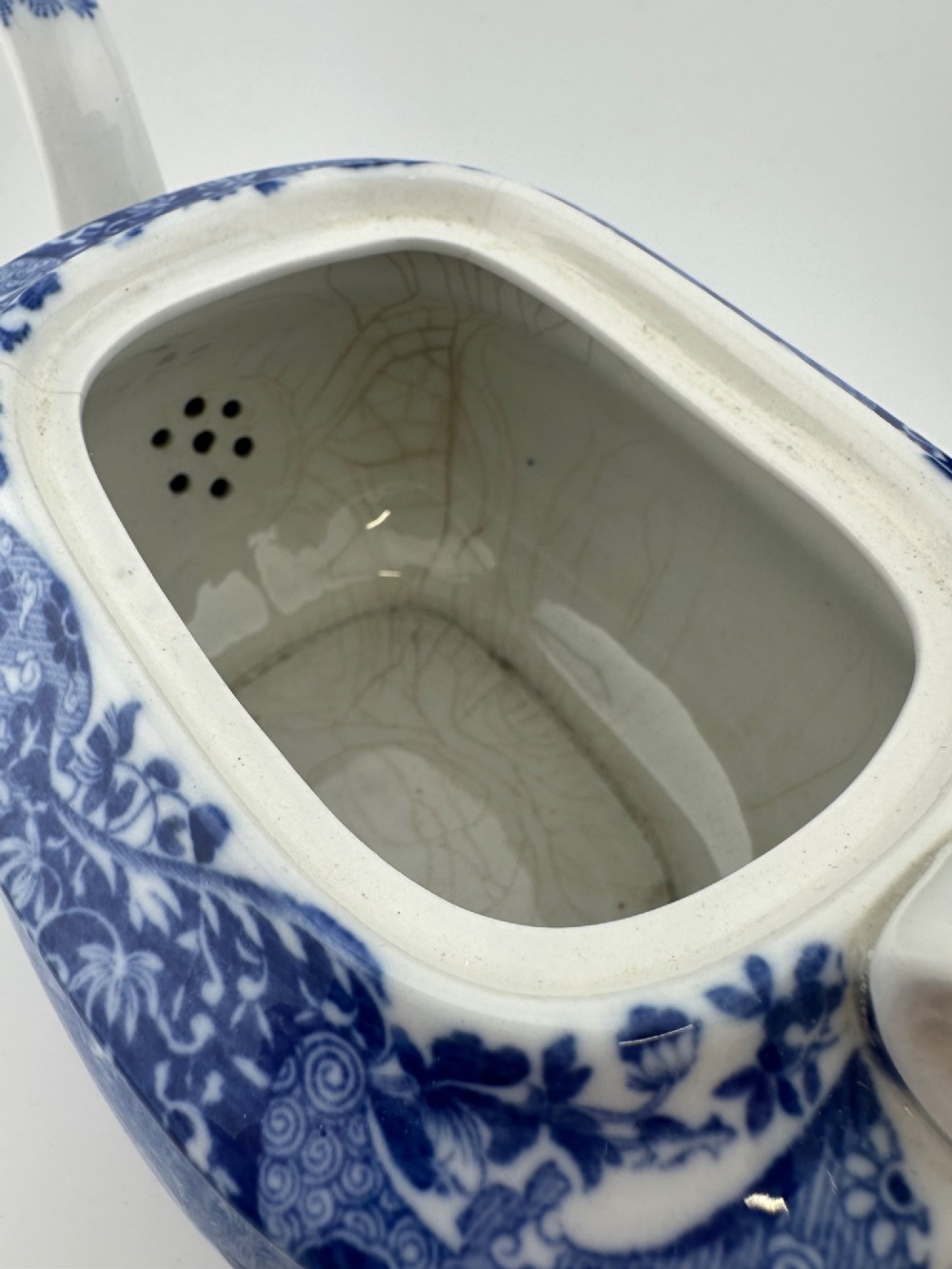 An antique blue and white transferware ceramic teapot in the Copeland Spode Blue Italian pattern featuring an Egyptian shape profile. View IX