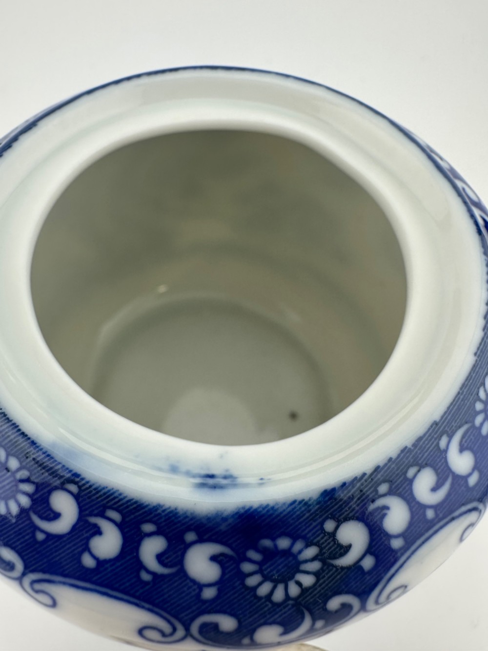 A Japanese Meiji period blue and white porcelain incense burner decorated with hand-painted prunus branches, featuring a fitted lid and side lugs. View VIII