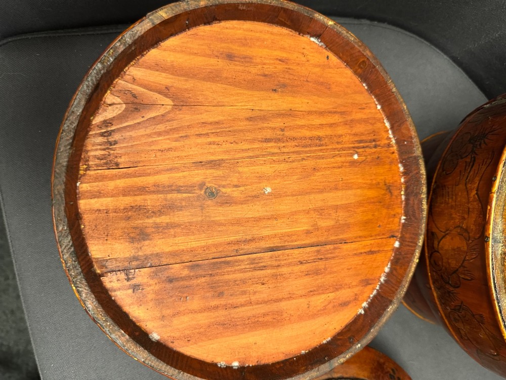A three-tiered late 19th-century Chinese bamboo and wood food carrier with an arched handle, featuring hand-painted yellow flowers, birds, and goldfish against a warm brown lacquer finish. View XII