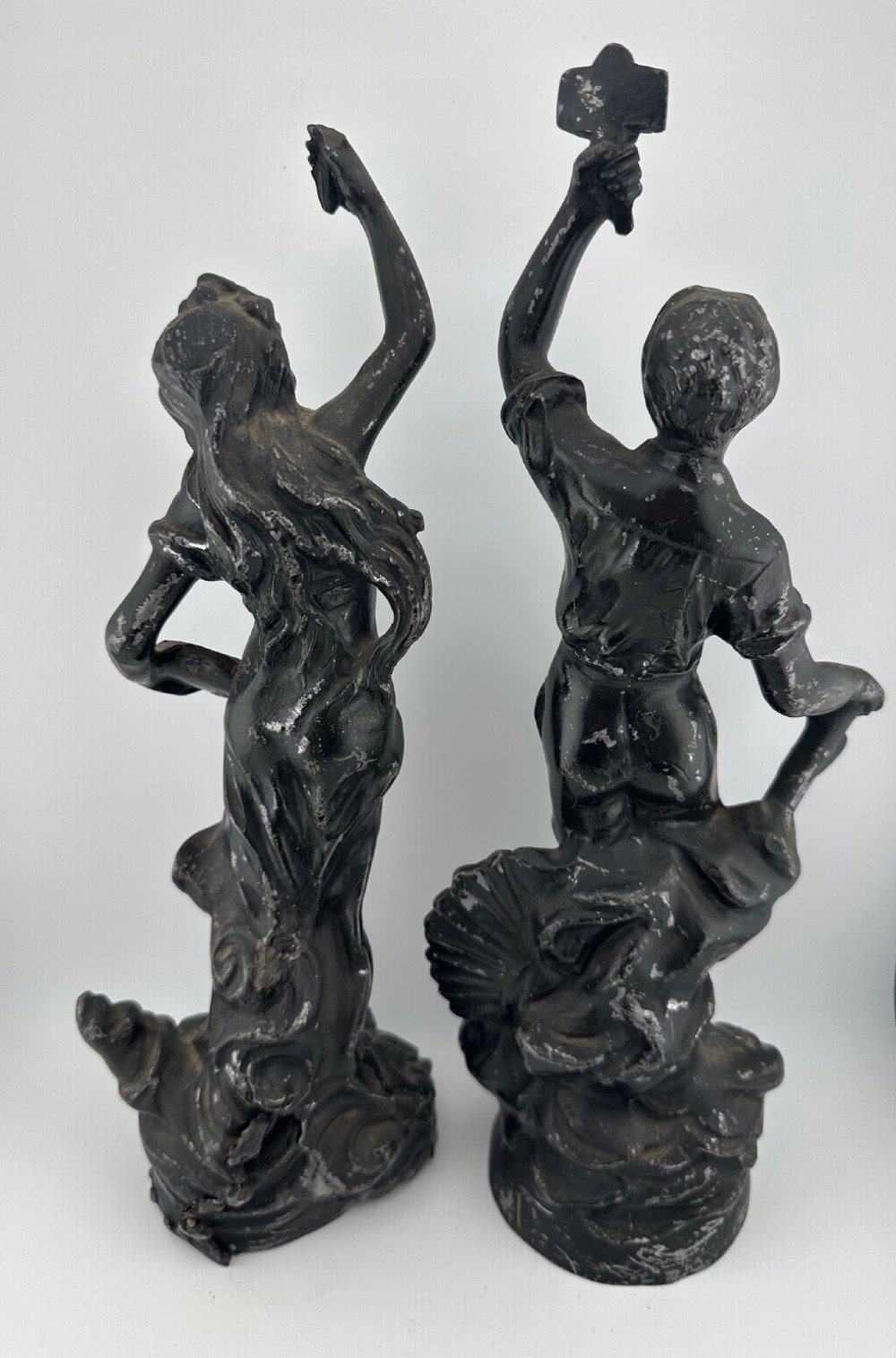 A pair of dark bronze-finished French spelter allegorical figures raised on moulded circular bases representing Mutualite and Paix. View III