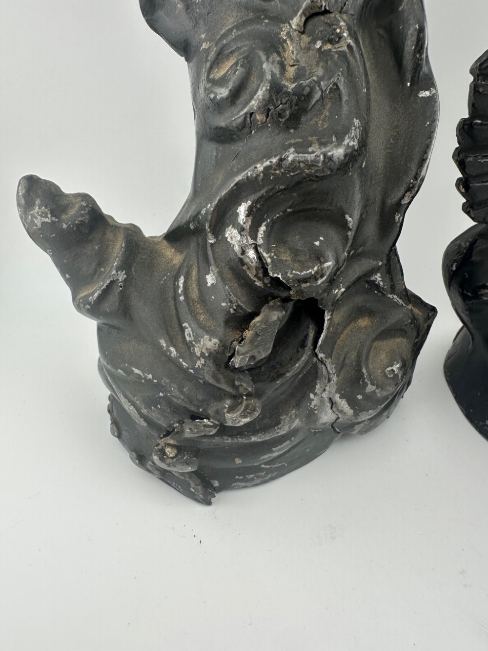 A pair of dark bronze-finished French spelter allegorical figures raised on moulded circular bases representing Mutualite and Paix. View IV