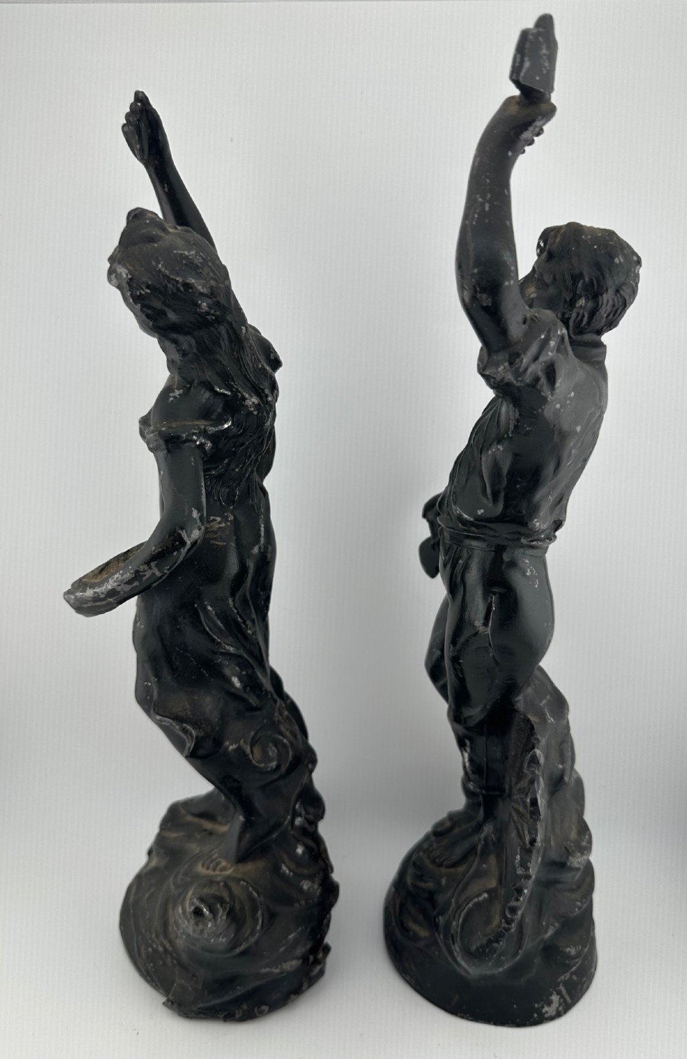A pair of dark bronze-finished French spelter allegorical figures raised on moulded circular bases representing Mutualite and Paix. View VI