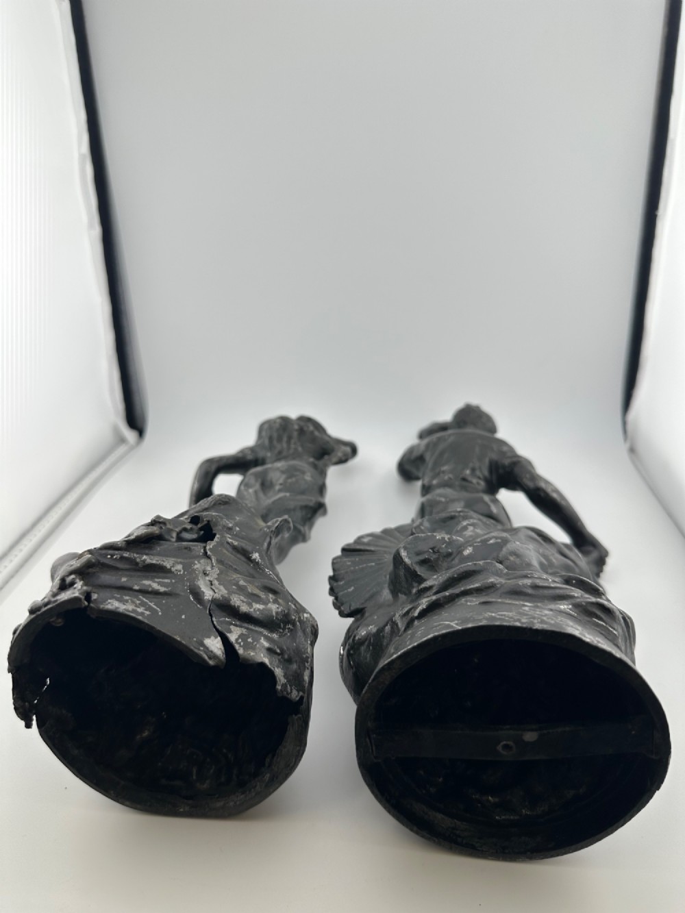 A pair of dark bronze-finished French spelter allegorical figures raised on moulded circular bases representing Mutualite and Paix. View VIII