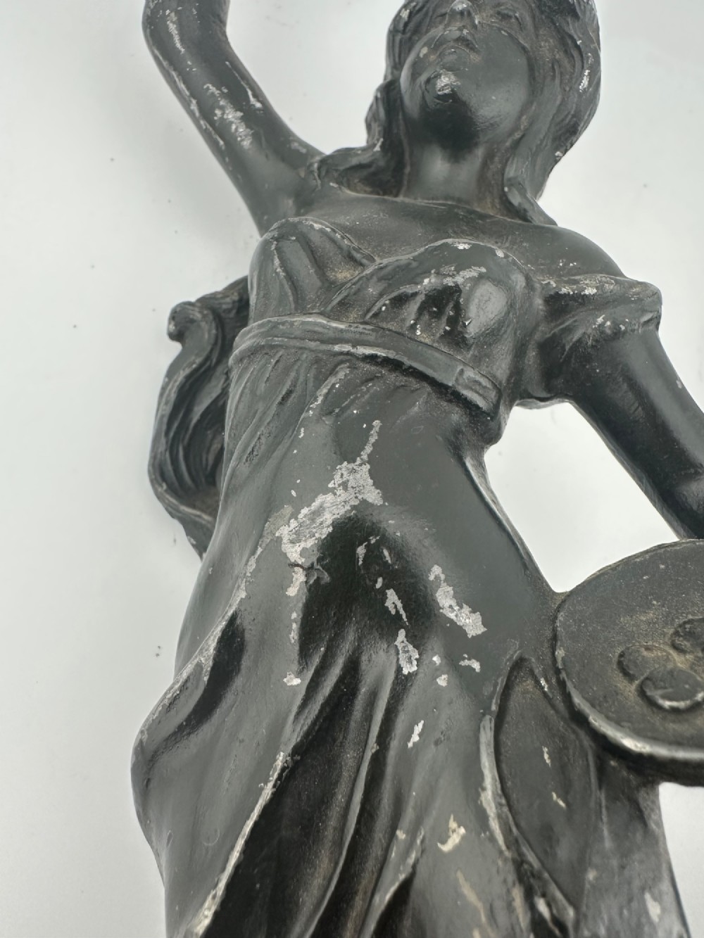 A pair of dark bronze-finished French spelter allegorical figures raised on moulded circular bases representing Mutualite and Paix. View XV