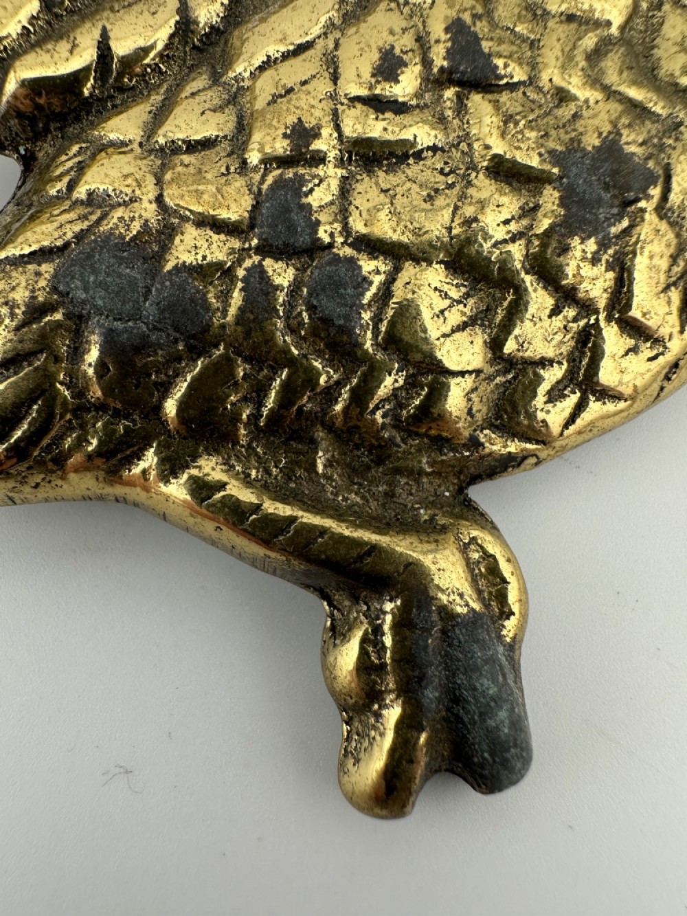 A set of three graduated cast brass flying geese wall plaques arranged by size with textured feather detailing. View XII