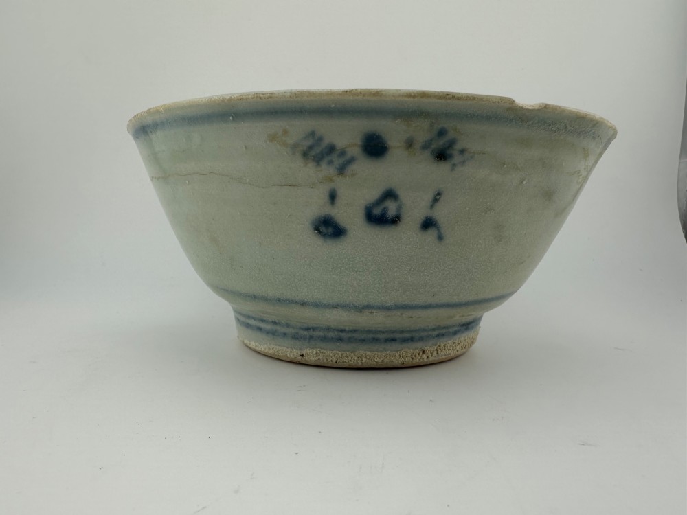 A nineteenth century Chinese Qing Dynasty shipwreck porcelain bowl decorated with cobalt blue underglaze landscape imagery. View VII