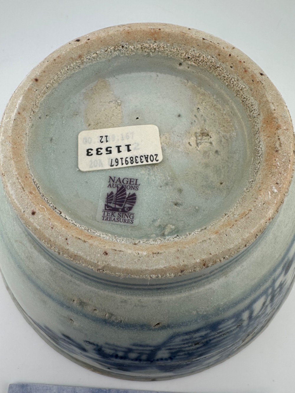 A nineteenth century Chinese Qing Dynasty shipwreck porcelain bowl decorated with cobalt blue underglaze landscape imagery. View VIII
