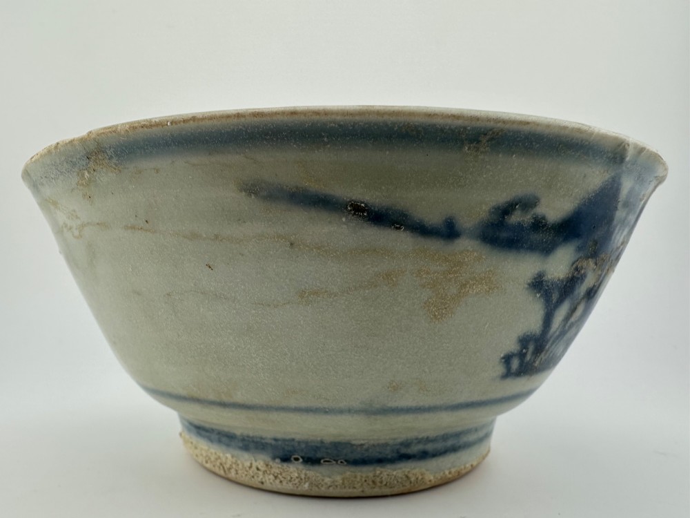 A nineteenth century Chinese Qing Dynasty shipwreck porcelain bowl decorated with cobalt blue underglaze landscape imagery. View XI