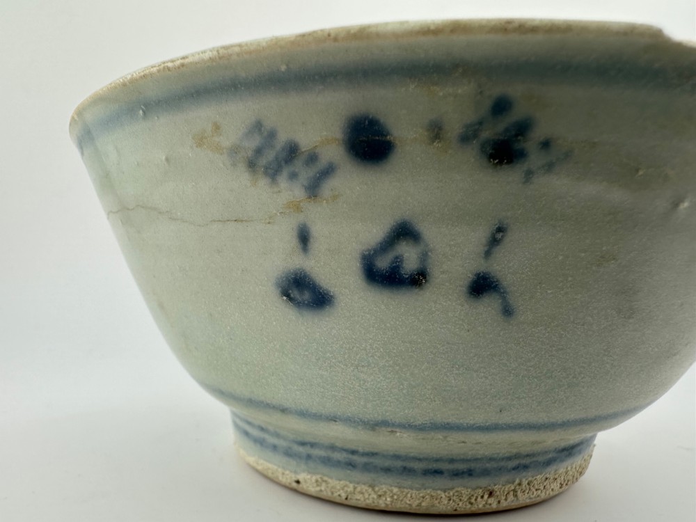 A nineteenth century Chinese Qing Dynasty shipwreck porcelain bowl decorated with cobalt blue underglaze landscape imagery. View XII