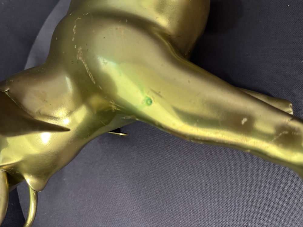 A vintage cast brass elephant sculpture standing with its trunk raised high. View VII