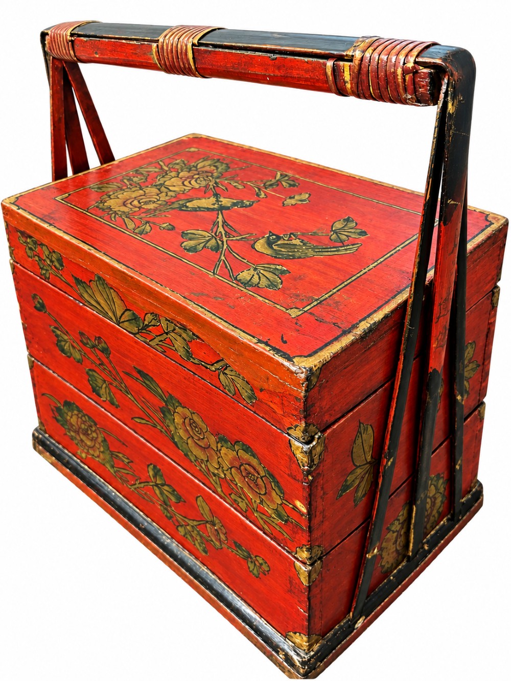 A three-tiered Chinese red lacquer wedding basket featuring hand-painted gold floral motifs and a black wooden carrying handle.