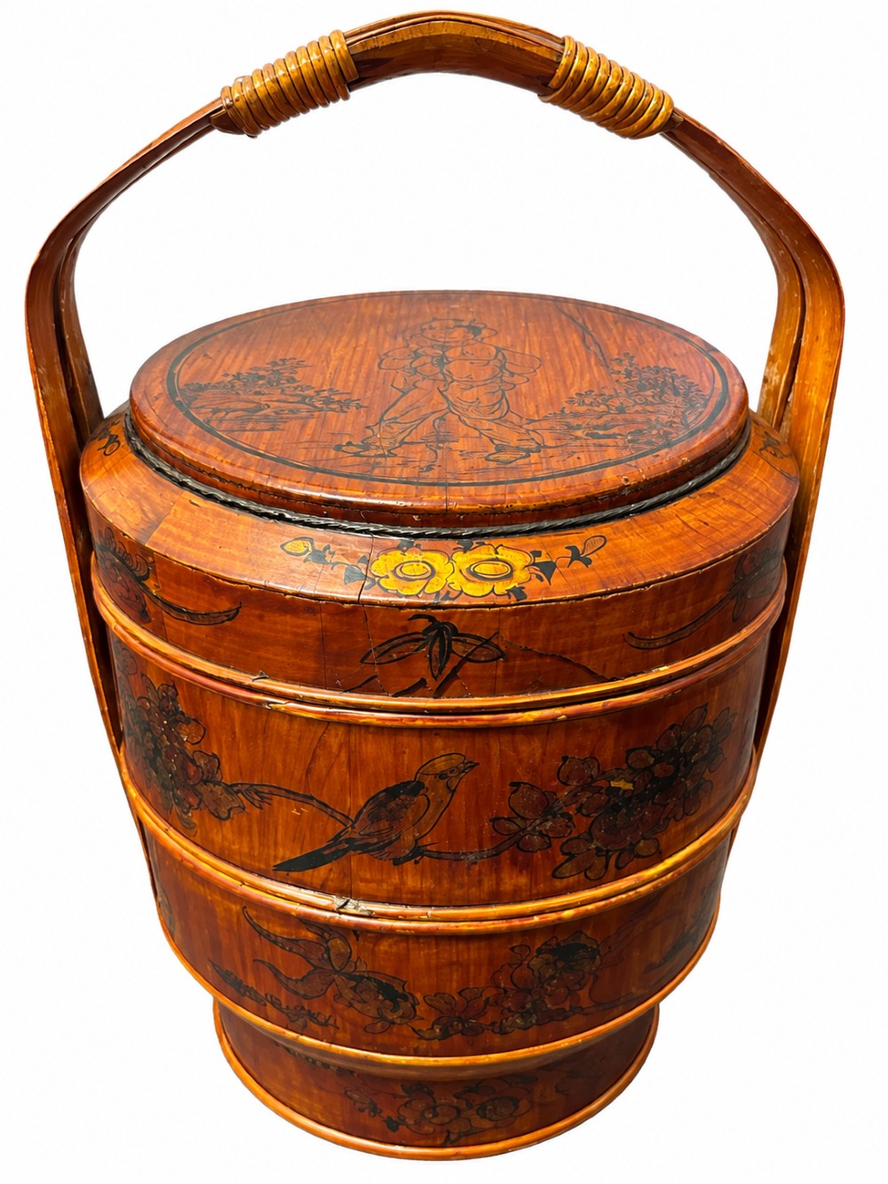 A late Qing Dynasty tiered Chinese food basket crafted from warm amber bamboo and wood, hand-painted with black line illustrations of a child on the lid and floral motifs around the body. View II