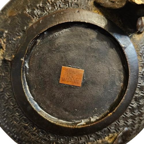 A dark bronze globular tripod incense burner featuring colourful enamel lotus motifs, side ring handles, and a pierced lid with a seated Qilin finial. View IX