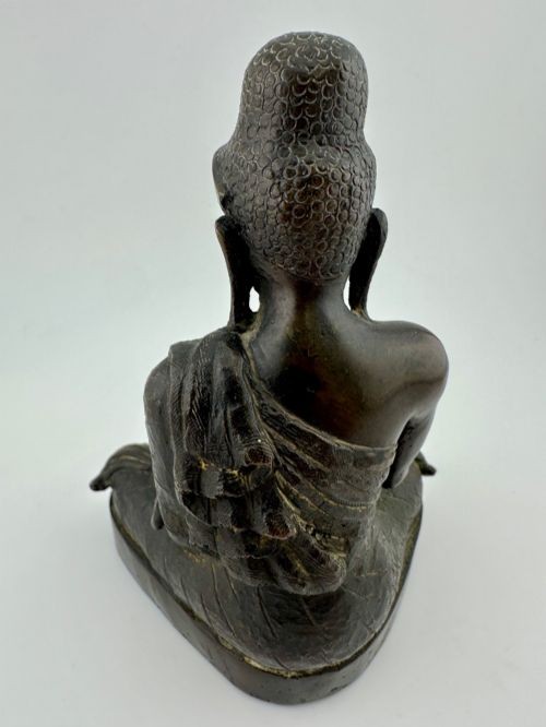 A 19th-century Burmese cast bronze figure of Shakyamuni Buddha seated cross-legged in the Bhumisparsha mudra position. View IV
