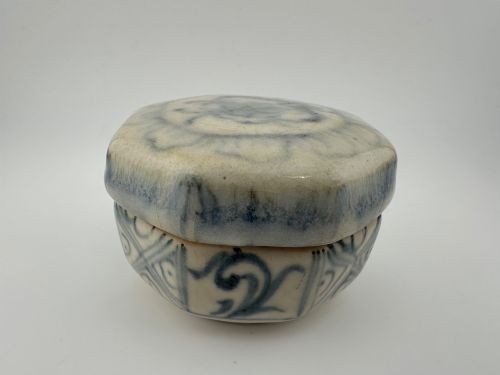 An antique octagonal ceramic lidded box featuring cobalt blue hand-painted scrolling motifs against an off-white glaze. View XV