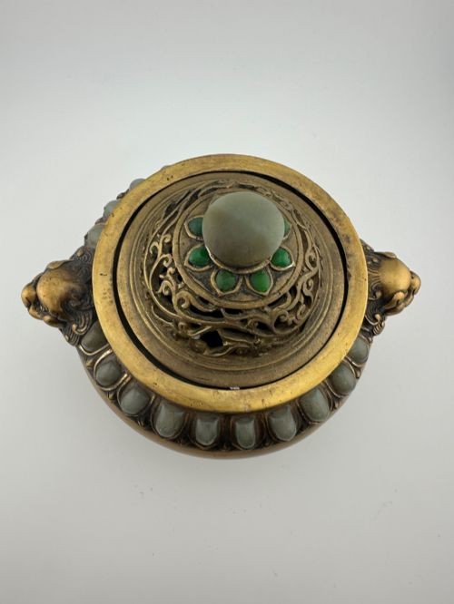 An antique cast bronze Chinese censer featuring a pierced cover, beast-head handles, inlaid green hardstone petals, and a matching fitted bronze stand. View III
