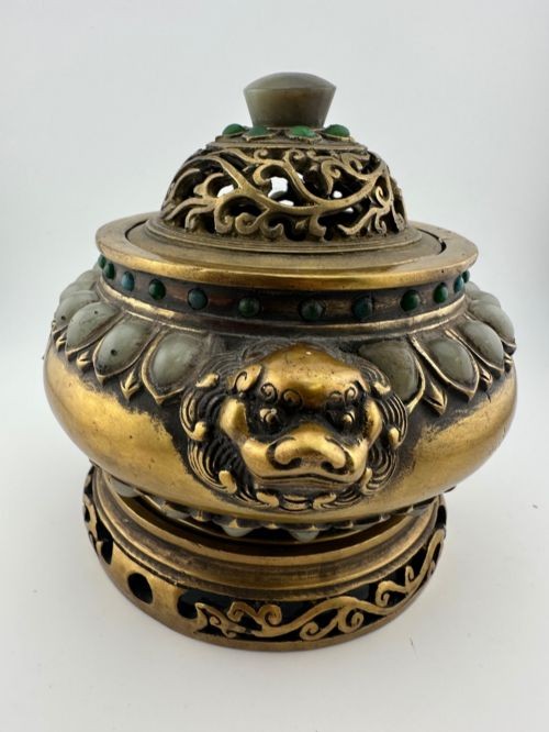An antique cast bronze Chinese censer featuring a pierced cover, beast-head handles, inlaid green hardstone petals, and a matching fitted bronze stand. View IV
