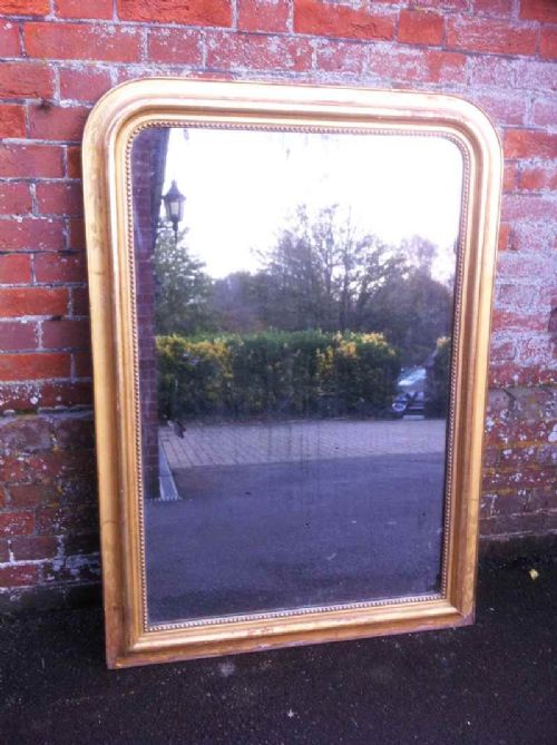 Large 19th Century Gilt Carved Wood and Gesso Arched Top Mirror.