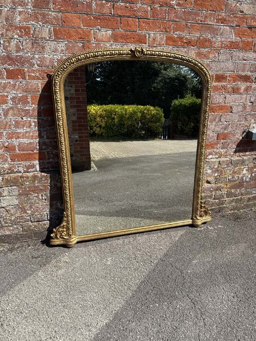 A Stunning Large Antique English 19th Century Carved Wood and Gesso Arched Top Gilt Overmantle Mirror.